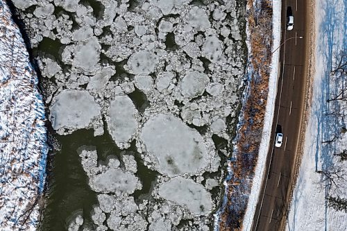 21112024
Ice begins to form on the Assiniboine River next to First Street North in Brandon on Thursday.  (Tim Smith/The Brandon Sun)