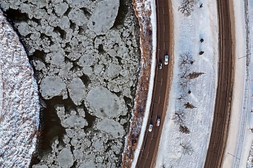 21112024
Ice begins to form on the Assiniboine River next to First Street North in Brandon on Thursday.  (Tim Smith/The Brandon Sun)