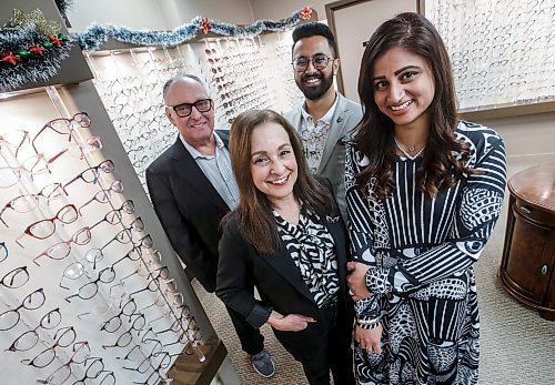 JOHN WOODS / FREE PRESS
Dr. Romie Dhaliwal, O.D., right front, an optometrist, and her business partner contact lens optician Arshdeep Manghera, right rear, have recently purchased Academy Optical, a 30-year-old business, from Rhonda and Zvi Gordon, and are photographed Monday, November 18, 2024. Rhonda Gordon still works at the store on a casual basis.

Reporter: aaron