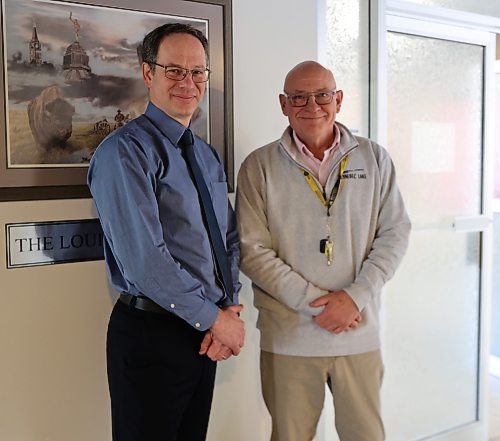 Brandon University's Peter Hickey, (left) vice president administration and finance, and David Docherty, president - stand outside the Louis Riel boardroom at BU Saturday morning, taking a break during the Board of Governors November meeting. (Michele McDougall/The Brandon Sun)