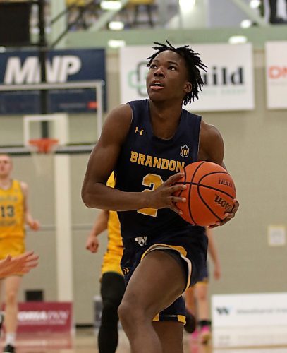 Brandon University Bobcats rookie Youri Cange (2) held Alberta's Isaac Simon to 11 points in a 78-59 BU victory at the Healthy Living Centre on Saturday, improving to 2-6 on the Canada West men's basketball season. (Thomas Friesen/The Brandon Sun)