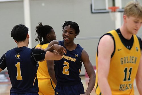 Brandon University Bobcats rookie Youri Cange (2) held Alberta's Isaac Simon to 11 points in a 78-59 BU victory at the Healthy Living Centre on Saturday, improving to 2-6 on the Canada West men's basketball season. (Thomas Friesen/The Brandon Sun)