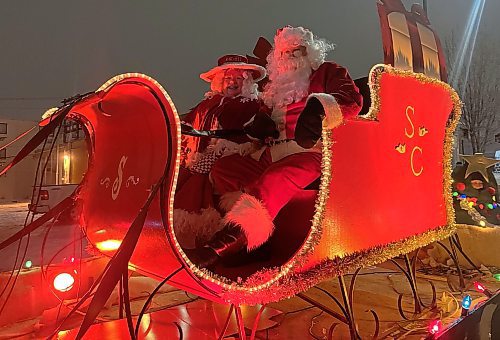 Santa and Mrs. Claus are seen in their sleigh at the end of the parade route during the 2024 Brandon Santa Parade Saturday evening. (Michele McDougall/The Brandon Sun) 