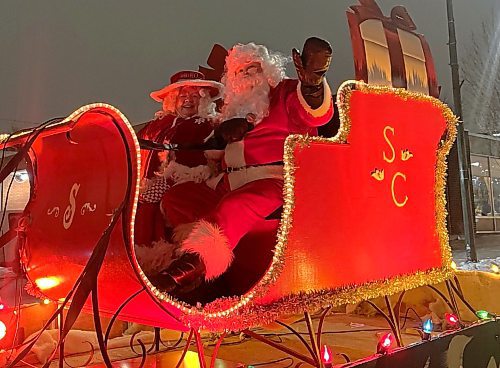 Santa and Mrs. Claus are seen in their sleigh at the end of the parade route during the 2024 Brandon Santa Parade Saturday evening. (Michele McDougall/The Brandon Sun) 