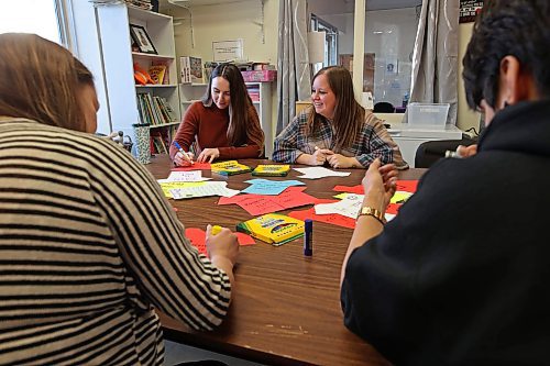 Megan Prince, Kelsey Crandall, Jamie Brown and Jennifer Bernhardt with the Women’s Resource Centre create T-shirt signs for the clothesline project with other WRC staff members on Friday afternoon. November marks Domestic Violence Awareness Month and the 'T-shirts' will be hung from a clothesline in Princess Park on Nov. 28 h to bring attention to domestic violence. (Tim Smith/The Brandon Sun)