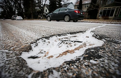 JOHN WOODS / FREE PRESS
A pothole on Ash Street Sunday, November 24, 2024. 

Reporter: scott