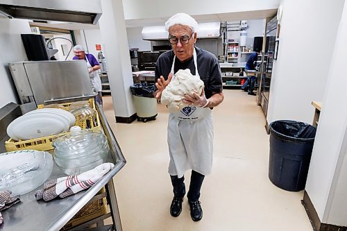 MIKE DEAL / FREE PRESS
Rick Kendall carries a big ball of dough from the mixing station to the dough balling station.
St. Joseph's Ukrainian Catholic Church (250 Jefferson Ave) perogie &quot;bee,&quot; which has been going on for years, ahead of the holidays.
A group of volunteers who've been making perogies for eons, in the basement of the church, pinching perogies that will go on sale the following week.
Reporter: David Sanderson
241120 - Wednesday, November 20, 2024.