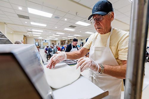 MIKE DEAL / FREE PRESS
Ron Lukie at the dough rolling station flattens the dough balls out for the cutters.
St. Joseph's Ukrainian Catholic Church (250 Jefferson Ave) perogie &quot;bee,&quot; which has been going on for years, ahead of the holidays.
A group of volunteers who've been making perogies for eons, in the basement of the church, pinching perogies that will go on sale the following week.
Reporter: David Sanderson
241120 - Wednesday, November 20, 2024.