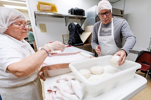 MIKE DEAL / FREE PRESS
Hazel Kiernicki (left) and Bohdan Wowczuk take a huge ball of dough and break it down to smaller ones that will head to the rolling station.
St. Joseph's Ukrainian Catholic Church (250 Jefferson Ave) perogie &quot;bee,&quot; which has been going on for years, ahead of the holidays.
A group of volunteers who've been making perogies for eons, in the basement of the church, pinching perogies that will go on sale the following week.
Reporter: David Sanderson
241120 - Wednesday, November 20, 2024.