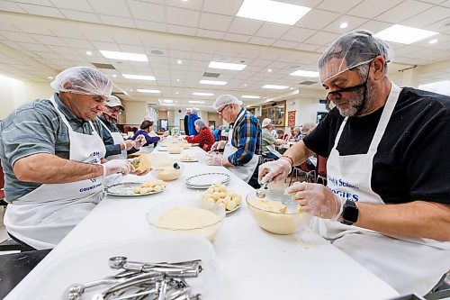 MIKE DEAL / FREE PRESS
Jozef Popiel (left) and Walter Maszczak (right) make little balls of filling that will be used in the perogies.
St. Joseph's Ukrainian Catholic Church (250 Jefferson Ave) perogie &quot;bee,&quot; which has been going on for years, ahead of the holidays.
A group of volunteers who've been making perogies for eons, in the basement of the church, pinching perogies that will go on sale the following week.
Reporter: David Sanderson
241120 - Wednesday, November 20, 2024.