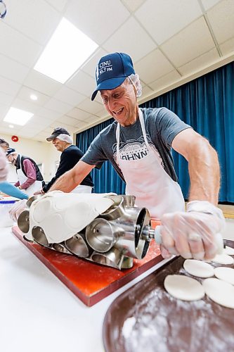 MIKE DEAL / FREE PRESS
Gary Lukie uses a custom made cutter to form the little patties of dough used to make the perogies.
St. Joseph's Ukrainian Catholic Church (250 Jefferson Ave) perogie &quot;bee,&quot; which has been going on for years, ahead of the holidays.
A group of volunteers who've been making perogies for eons, in the basement of the church, pinching perogies that will go on sale the following week.
Reporter: David Sanderson
241120 - Wednesday, November 20, 2024.