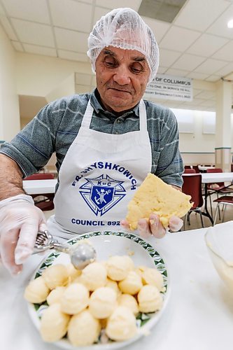 MIKE DEAL / FREE PRESS
Jozef Popiel makes little balls of filling that will be used in the perogies.
St. Joseph's Ukrainian Catholic Church (250 Jefferson Ave) perogie &quot;bee,&quot; which has been going on for years, ahead of the holidays.
A group of volunteers who've been making perogies for eons, in the basement of the church, pinching perogies that will go on sale the following week.
Reporter: David Sanderson
241120 - Wednesday, November 20, 2024.