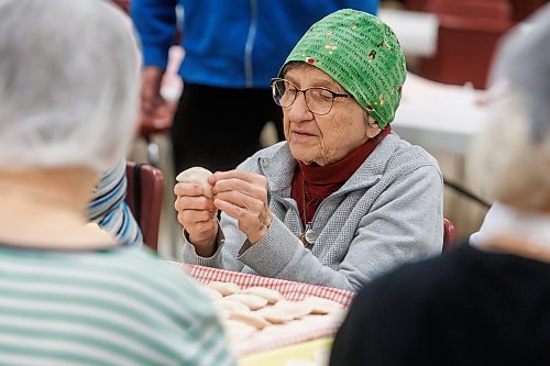 MIKE DEAL / FREE PRESS
Darlene Sidak wearing a homemade hair net pinches perogies.
St. Joseph's Ukrainian Catholic Church (250 Jefferson Ave) perogie &quot;bee,&quot; which has been going on for years, ahead of the holidays.
A group of volunteers who've been making perogies for eons, in the basement of the church, pinching perogies that will go on sale the following week.
Reporter: David Sanderson
241120 - Wednesday, November 20, 2024.