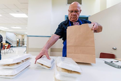 MIKE DEAL / FREE PRESS
Stephen Sumka takes freshly packaged perogies and bags them up for a customers order.
St. Joseph's Ukrainian Catholic Church (250 Jefferson Ave) perogie &quot;bee,&quot; which has been going on for years, ahead of the holidays.
A group of volunteers who've been making perogies for eons, in the basement of the church, pinching perogies that will go on sale the following week.
Reporter: David Sanderson
241120 - Wednesday, November 20, 2024.