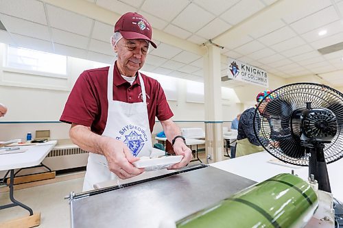 MIKE DEAL / FREE PRESS
Dennis Beyak wraps the perogies in plastic wrap.
St. Joseph's Ukrainian Catholic Church (250 Jefferson Ave) perogie &quot;bee,&quot; which has been going on for years, ahead of the holidays.
A group of volunteers who've been making perogies for eons, in the basement of the church, pinching perogies that will go on sale the following week.
Reporter: David Sanderson
241120 - Wednesday, November 20, 2024.