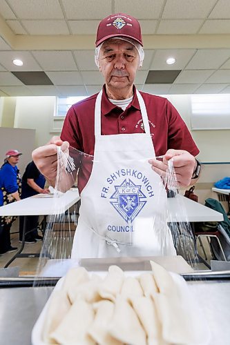 MIKE DEAL / FREE PRESS
Dennis Beyak wraps the perogies in plastic wrap.
St. Joseph's Ukrainian Catholic Church (250 Jefferson Ave) perogie &quot;bee,&quot; which has been going on for years, ahead of the holidays.
A group of volunteers who've been making perogies for eons, in the basement of the church, pinching perogies that will go on sale the following week.
Reporter: David Sanderson
241120 - Wednesday, November 20, 2024.