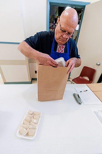 MIKE DEAL / FREE PRESS
Stephen Sumka takes freshly packaged perogies and bags them up for a customers order.
St. Joseph's Ukrainian Catholic Church (250 Jefferson Ave) perogie &quot;bee,&quot; which has been going on for years, ahead of the holidays.
A group of volunteers who've been making perogies for eons, in the basement of the church, pinching perogies that will go on sale the following week.
Reporter: David Sanderson
241120 - Wednesday, November 20, 2024.