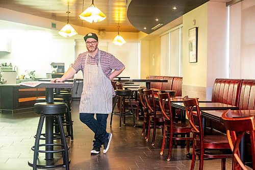 MIKAELA MACKENZIE / WINNIPEG FREE PRESS

Nick Graumann, chef/owner of Nick&#x2019;s on Broadway, at the restaurant on Tuesday, Dec. 5, 2023. Nick&#x2019;s on Broadway has a &#x201c;budget bites&#x201d; menu, where everything is around $4. The menu, made to attract customers, has gotten very popular. For Gabby story.
Winnipeg Free Press 2023