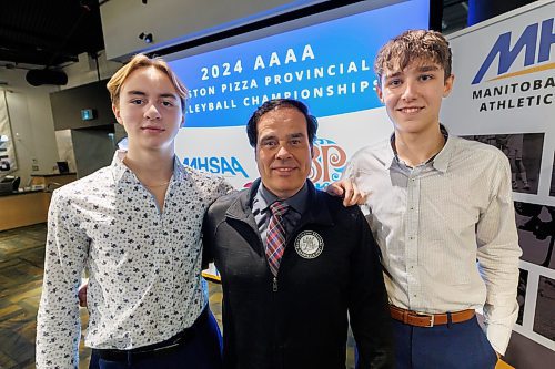 MIKE DEAL / FREE PRESS
Gabrielle-Roy Les Roys boys volleyball team members, Martin de Moissac (left) and Alek Ouimet (right) along with Coach Michel Lavergne at the schedule announcement for the 2024&#xa0;Boston Pizza AAAA Provincial Volleyball Championships at the Manitoba Sports Hall of Fame (145 Pacific Avenue) Tuesday afternoon.
Reporter: Mike Sawatzky
241126 - Tuesday, November 26, 2024.