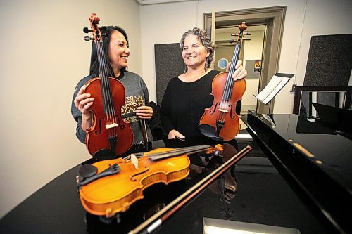 MIKAELA MACKENZIE / FREE PRESS
	
Metis fiddling instructor Patti Kusturok (right) and Indigenous Studies grad student Krysta Alexson at the University of Manitoba on Tuesday, Nov. 26, 2024. The new class is the first of its kind in Canada, and was inspired by reconciliation.

For Scott story.
Winnipeg Free Press 2024