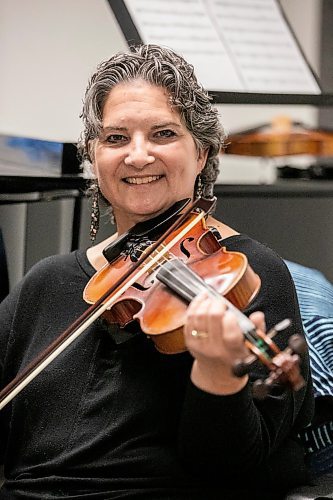 MIKAELA MACKENZIE / FREE PRESS
	
Metis fiddling instructor Patti Kusturok in her classroom at the University of Manitoba on Tuesday, Nov. 26, 2024. The new class is the first of its kind in Canada, and was inspired by reconciliation.

For Scott story.
Winnipeg Free Press 2024