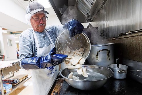 MIKE DEAL / FREE PRESS
George Gaba pours boiled perogies into a bowl of cold water to cool them down so they can be packaged up for sale.
St. Joseph's Ukrainian Catholic Church (250 Jefferson Ave) perogie "bee," which has been going on for years, ahead of the holidays.
A group of volunteers who've been making perogies for eons, in the basement of the church, pinching perogies that will go on sale the following week.
Reporter: David Sanderson
241120 - Wednesday, November 20, 2024.