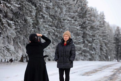 27112024
Katherine Mansoy and Hilary Macalanda take photos together amongst the hoar-frost covered trees at the Brandon Research and Development Centre off Grand Valley Road on a crisp Wednesday morning. 
(Tim Smith/The Brandon Sun)