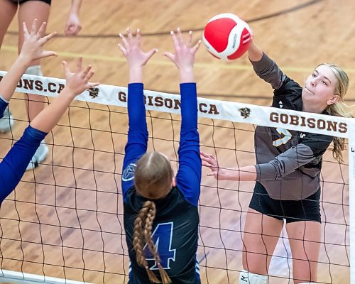 BROOK JONES/FREE PRESS
he Vincent Massey (Brandon) Vikings earned a victory over the Steinbach Sabres in the semi-finals (final four) of the Boston Pizza AAAA Varisty Girls Volleyball Championships hosted by the Maintoba High Schools Athletic Association inside Investors Group Athletic Centre at the University of Manitoba Fort Garry campus in Winnipeg, Man., Wednesday, Nov. 27, 2024. With the win, the Vikings will compete in the MHSAAA provincial volleyball championships at IGAC Monday, Dec. 2, 2024. Pictured: Steinbach Sabres outside hitter (No. 7) spikes the volleyball as Vincent Massey Vikings right side/left side Zoe Price (No. 4) goes up for the block during second set action.