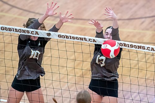 BROOK JONES/FREE PRESS
he Vincent Massey (Brandon) Vikings earned a victory over the Steinbach Sabres in the semi-finals (final four) of the Boston Pizza AAAA Varisty Girls Volleyball Championships hosted by the Maintoba High Schools Athletic Association inside Investors Group Athletic Centre at the University of Manitoba Fort Garry campus in Winnipeg, Man., Wednesday, Nov. 27, 2024. With the win, the Vikings will compete in the MHSAAA provincial volleyball championships at IGAC Monday, Dec. 2, 2024. Pictured: Steinbach Sabres middle Olivia Unrau (No. 10) and Sabres teammate outside hitter Jubilee Steppan (No. 13) go up for the block during second set action.