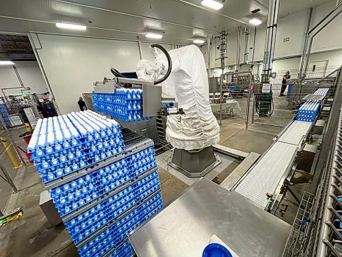 MIKE DEAL / FREE PRESS
A large robotic arm lifts huge pallets of eggs in the processing plant.
Agriculture Minister Ron Kostyshyn announces during a press conference at the Burnbrae Farms processing plant (500 Pandora Ave. W), that the governments of Canada and Manitoba are investing in several major capital infrastructure and investment projects under the Sustainable Canadian Agriculture Partnership (Sustainable CAP) that will increase food processing capacity in Manitoba, allowing producers to sell more of their product locally and create more agricultural jobs.
Reporter: Martin Cash
241128 - Thursday, November 28, 2024.