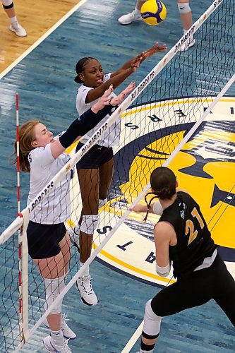 Brandon University Bobcats' Carly Thomson, left, and Nerissa Dyer attempt to block Abby Guezen of the Alberta Pandas during their Canada West women's volleyball match at the Healthy Living Centre on Friday. (Thomas Friesen/The Brandon Sun)