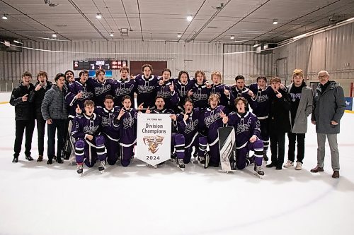 The Vincent Massey Vikings celebrate with the Victoria Inn high school hockey tournament banner following Sunday's 3-1 win over Westwood. (Matt Packwood/The Brandon Sun)