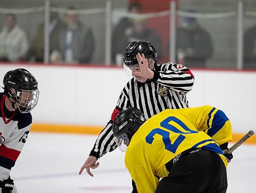 BROOK JONES/FREE PRESS
The City of Winnipeg and the Province of Manitoba rekindled a half-century old hockey rivalry at Gateway Recreation Centre in Winnipeg, Man., Saturday, Nov. 30, 2024. The friendly hockey game between politicans, Winnipeg's public service and provincial staff was held in celebration of Winnipeg's 150th anniversary. Pictured: Fress Press columnist Dan Lett (middle) drops the puck for a face off between Province team player MLA David Pankratz (left) and City team player Winnipeg Coun. Markus Chambers (right) during first period action.