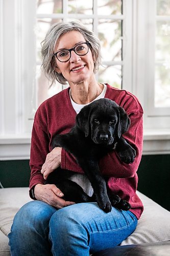 MIKAELA MACKENZIE / FREE PRESS
	
Lorraine Rempel, who volunteers her time raising puppies that will go on to become CNIB guide dogs, with Ollie on Friday, Nov. 29, 2024. 

For Aaron Epp story.
Winnipeg Free Press 2024