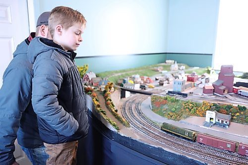 James Smith, 7, looks at the HO Scale layout built by the club members for five years. (Abiola Odutola/The Brandon Sun)