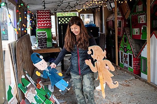 MIKAELA MACKENZIE / FREE PRESS
	
Jen de Delley takes her Christmas elf village out of storage in her carport workshop in River Heights on Monday, Nov. 18, 2024.

For AV story.
Winnipeg Free Press 2024