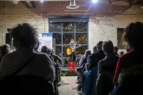 MIKAELA MACKENZIE / FREE PRESS
	
Madeleine Roger sings a few songs at the Winnipeg Free Press subscriber sip and shop event at The Forks on Monday, Dec. 2, 2024. 

Standup.
Winnipeg Free Press 2024