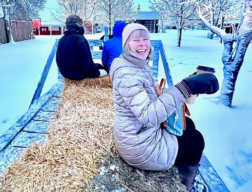 Gord Mackintosh / for the Free Press
Margie grasps hot chocolate aboard a Mennonite Heritage Village hayride.