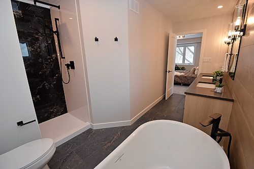 Todd Lewys / Free Press
A spa-like space, the ensuite comes with a heated tile floor, deep soaker tub and a gorgeous walk-in shower with black-marble backdrop.