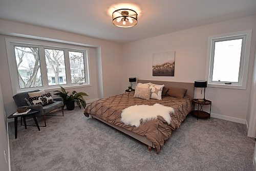 Todd Lewys / Free Press
The spacious primary bedroom is filled with natural light and offers beautiful treetop views of the mature, established neighbourhood.