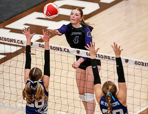 JOHN WOODS / WINNIPEG FREE PRESS
Vincent Massey Vikings&#x2019; Zoe Price (4) wins the point against Jeanne-Sauve Olympiens&#x2019; Lily Market (28) and Madison Steingart (20) in the Manitoba High School 2022 AAAA Varsity Volleyball Provincial Championship at the University of Manitoba Monday, December 2, 2024.