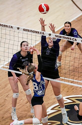 JOHN WOODS / WINNIPEG FREE PRESS
Vincent Massey Vikings&#x2019; Kipling Black (5) attempts to block the hit from Jeanne-Sauve Olympiens&#x2019; Lily Market (28) in the Manitoba High School 2022 AAAA Varsity Volleyball Provincial Championship at the University of Manitoba Monday, December 2, 2024.