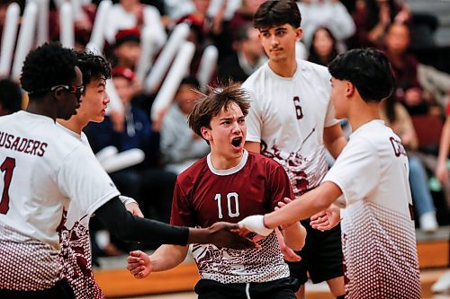 JOHN WOODS / WINNIPEG FREE PRESS
St Paul&#x2019;s Crusaders&#x2019; Nathan Brzak (10) and his team celebrate a point won against the River East Kodiaks in the Manitoba High School 2022 AAAA Varsity Volleyball Provincial Championship at the University of Manitoba Monday, December 2, 2024.