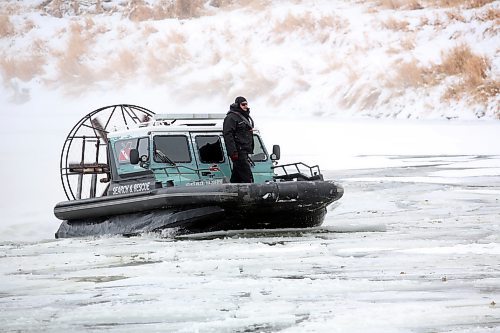 Members of the Hutterian Emergency Aquatic Response Team from Oak Bluff Colony Farms south of Winnipeg conduct a search of the Assiniboine River on Tuesday morning. The HEART team made several passes along the river in the search for Jeffrey Floresco, who has been missing since Nov. 21. (Matt Goerzen/The Brandon Sun)