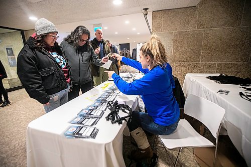 MIKAELA MACKENZIE / FREE PRESS
	
Sheena Rattai (right) registers Christina Leask (left) and Ronnie Pruden at End Homelessness Winnipeg&#x573; conference at the Winnipeg Art Gallery on Tuesday, Dec. 3, 2024. 

For Nicole Buffie story.
Winnipeg Free Press 2024