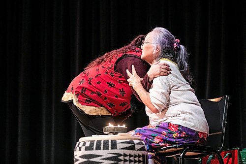 MIKAELA MACKENZIE / FREE PRESS
	
Throat singer Nikki Komaksiutksak (left) embraces elder Martha Peet after the lighting of the qullig at End Homelessness Winnipeg&#x573; conference at the Winnipeg Art Gallery on Tuesday, Dec. 3, 2024. 

For Nicole Buffie story.
Winnipeg Free Press 2024