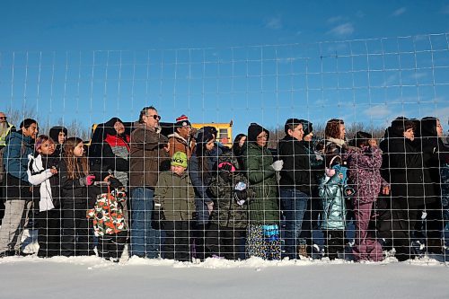 03122024
Community members crowd around the bison enclosure at Birdtail Sioux First Nation to watch as 11 bison, including one white bison, gifted to Birdtail by Sioux Valley Dakota Nation are released into their new enclosure on Tuesday. White bison are considered sacred by many First Nations and bison as a whole hold special cultural and spiritual significance. The bison were escorted through the community by the Sioux Valley Dakota Nation Unity Riders.    (Tim Smith/The Brandon Sun)