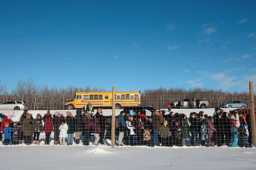 03122024
Community members crowd around the bison enclosure at Birdtail Sioux First Nation to watch as 11 bison, including one white bison, gifted to Birdtail by Sioux Valley Dakota Nation are released into their new enclosure on Tuesday. White bison are considered sacred by many First Nations and bison as a whole hold special cultural and spiritual significance. The bison were escorted through the community by the Sioux Valley Dakota Nation Unity Riders.    (Tim Smith/The Brandon Sun)