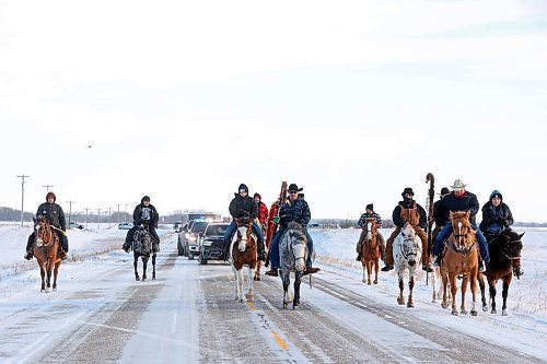 03122024
The Sioux Valley Dakota Nation Unity Riders lead the way to escort 11 bison (often referred to as buffalo in Dakota culture) through Birdtail Sioux First Nation to their new home in an enclosure in Birdtail&#x2019;s valley on Tuesday. The bison, including one white bison, were a gift to Birdtail from Sioux Valley. 
(Tim Smith/The Brandon Sun)