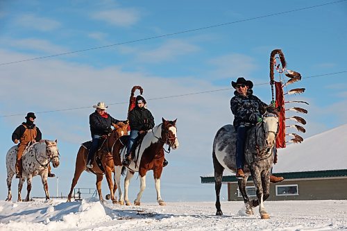 03122024
The Sioux Valley Dakota Nation Unity Riders lead the way to escort 11 bison (often referred to as buffalo in Dakota culture) through Birdtail Sioux First Nation to their new home in an enclosure in Birdtail&#x2019;s valley on Tuesday. The bison, including one white bison, were a gift to Birdtail from Sioux Valley. 
(Tim Smith/The Brandon Sun)